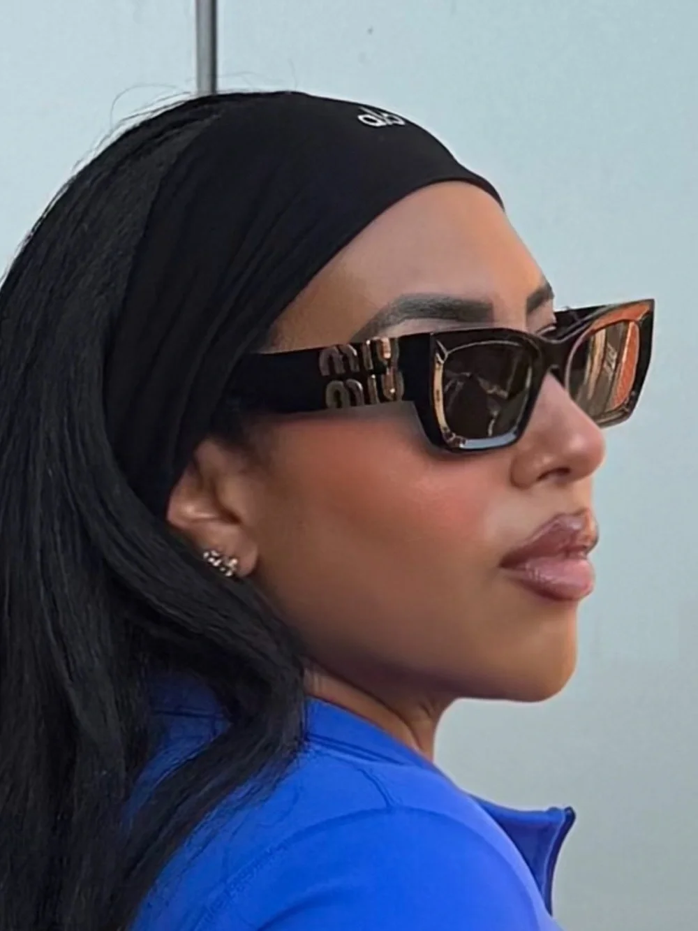 Miu Miu Black Cat-Eye Sunglasses with Gold Logo Details